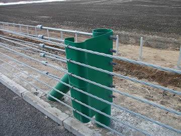 five cables fixed on the green PVC coated post by bracket